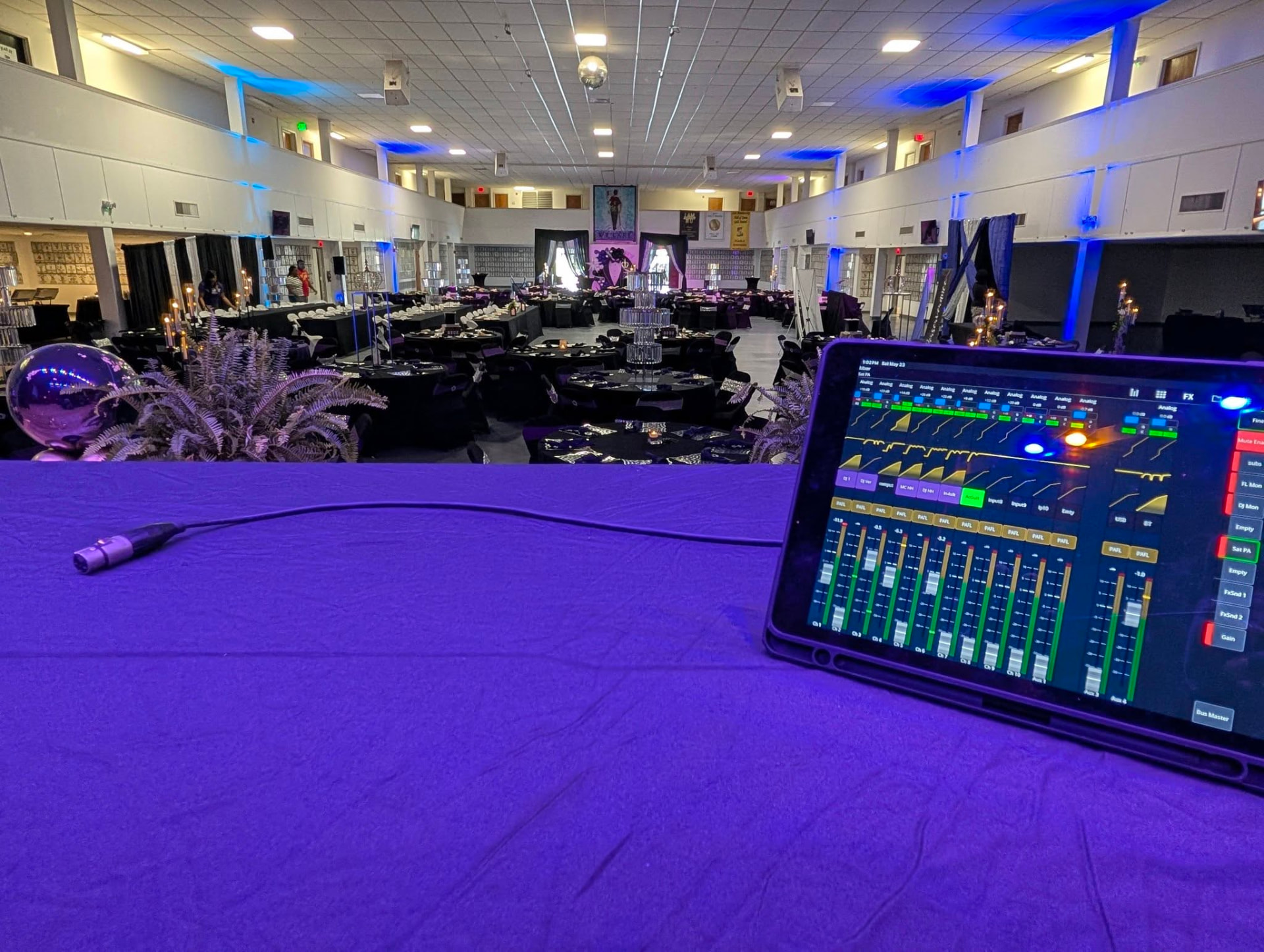 Digital mixing console running front-of-house sound at a banquet