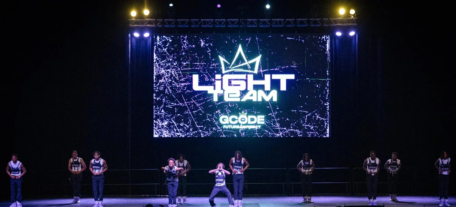 Wide view of a stage and lighting rig at a Pensacola community event